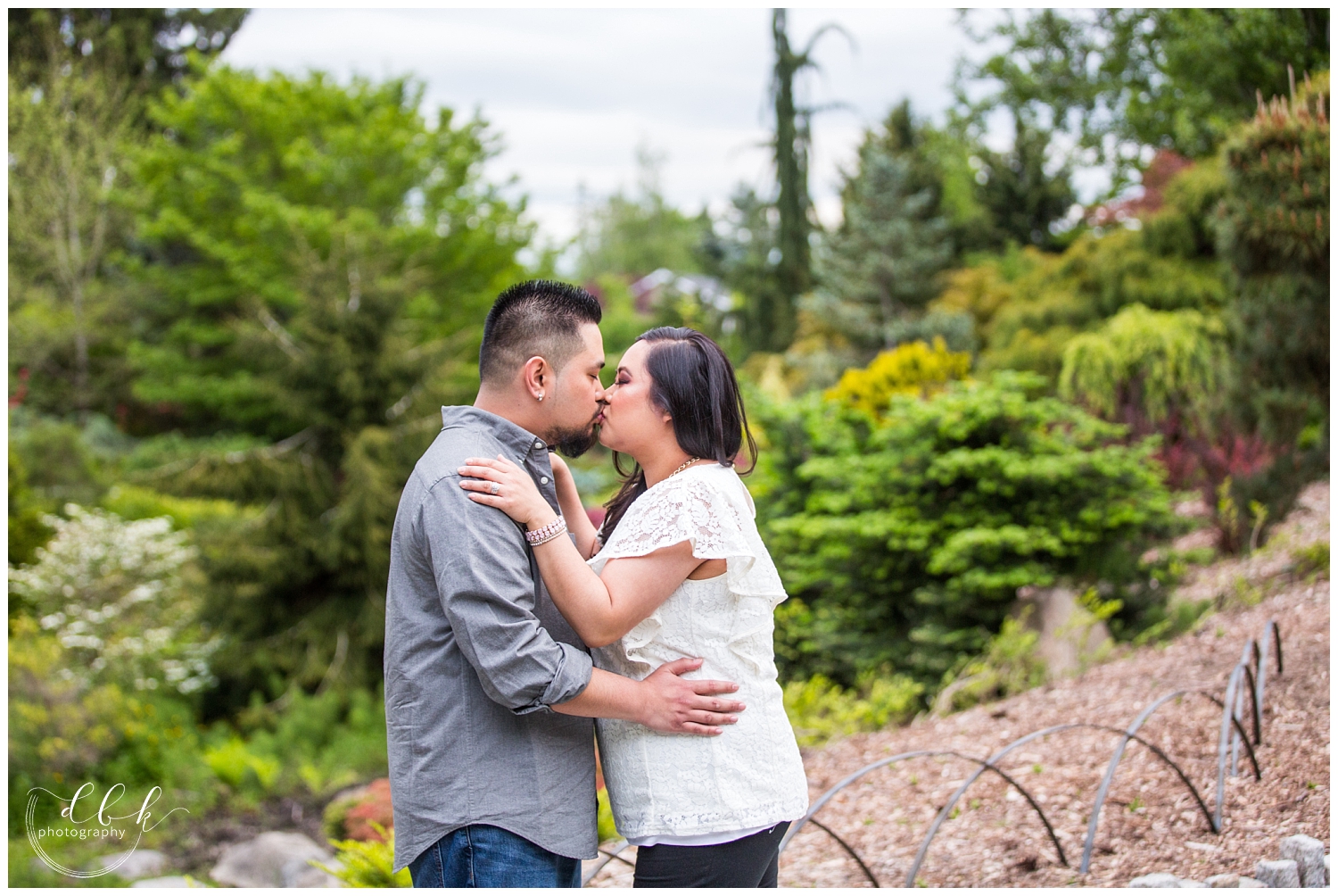couple kissing overlooking Kubota Garden in Seattle