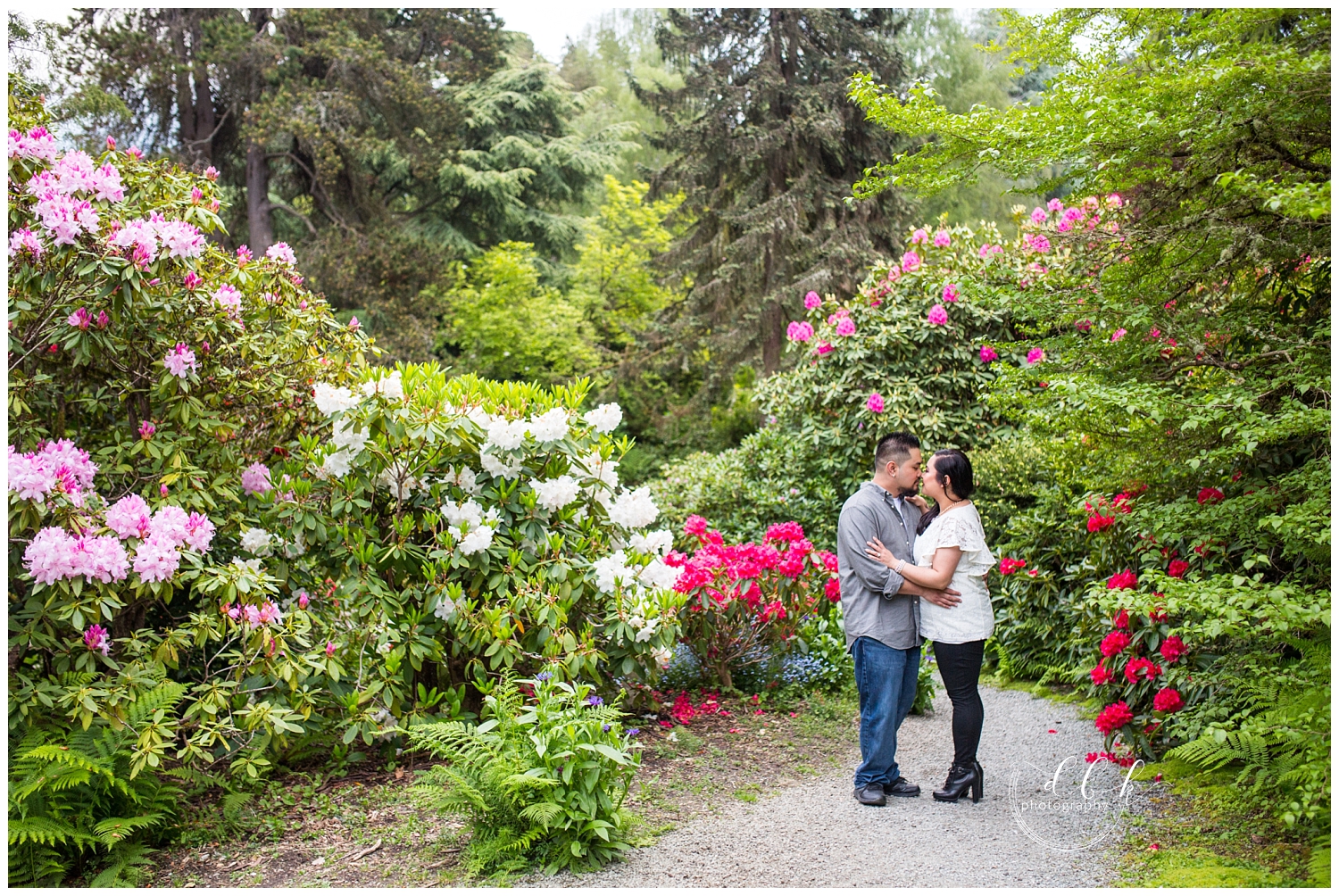 engaged couple surrounded by flowers at Kubota Garden in Seattle
