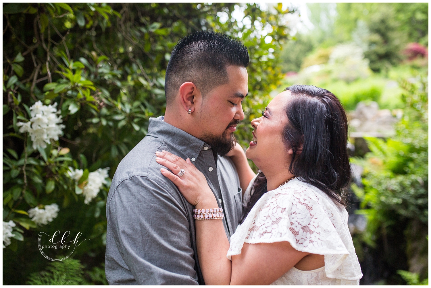 cute couple standing nose to nose for Kubota Garden engagement portraits