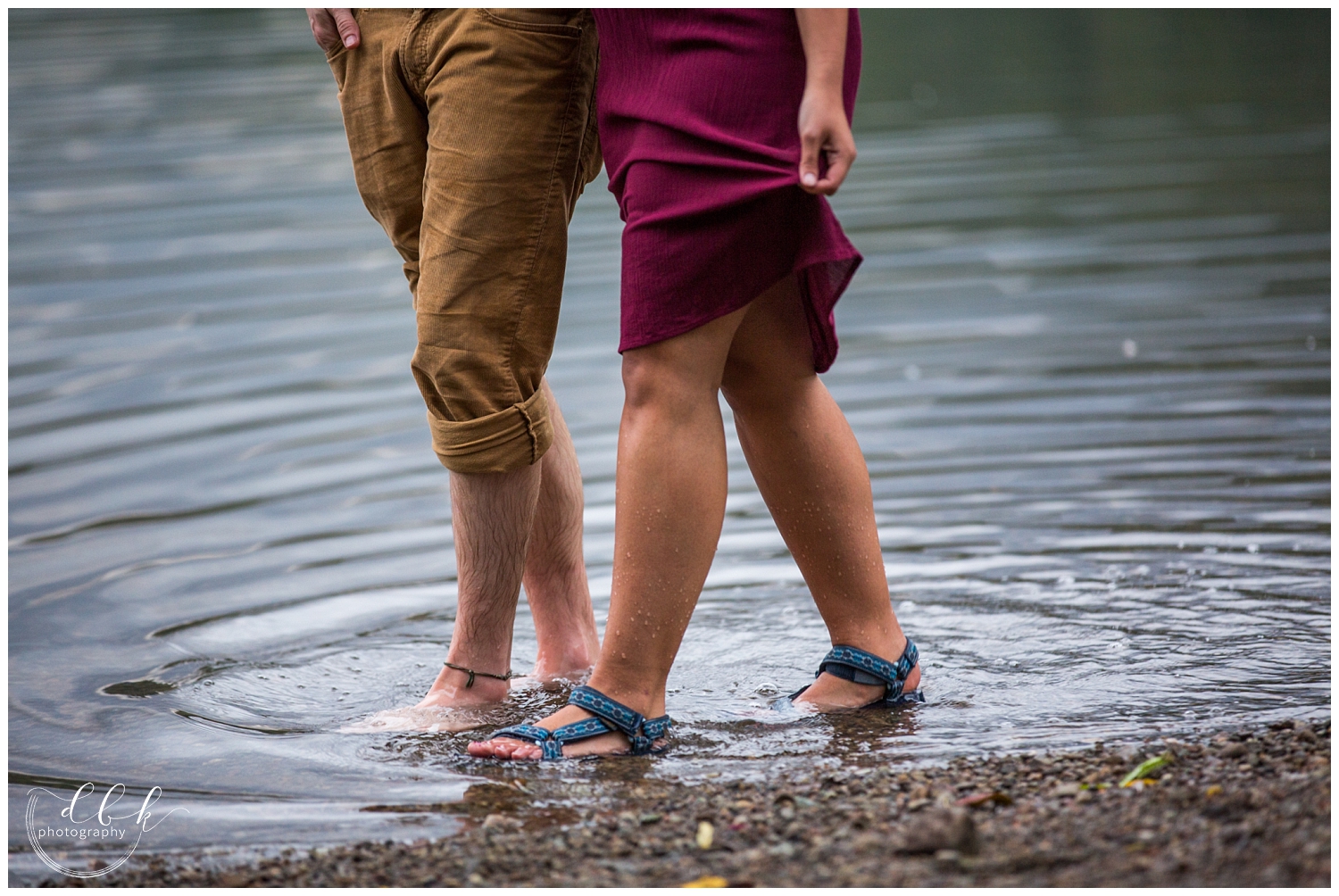 couple walking through the water together at Rattlesnake Lake