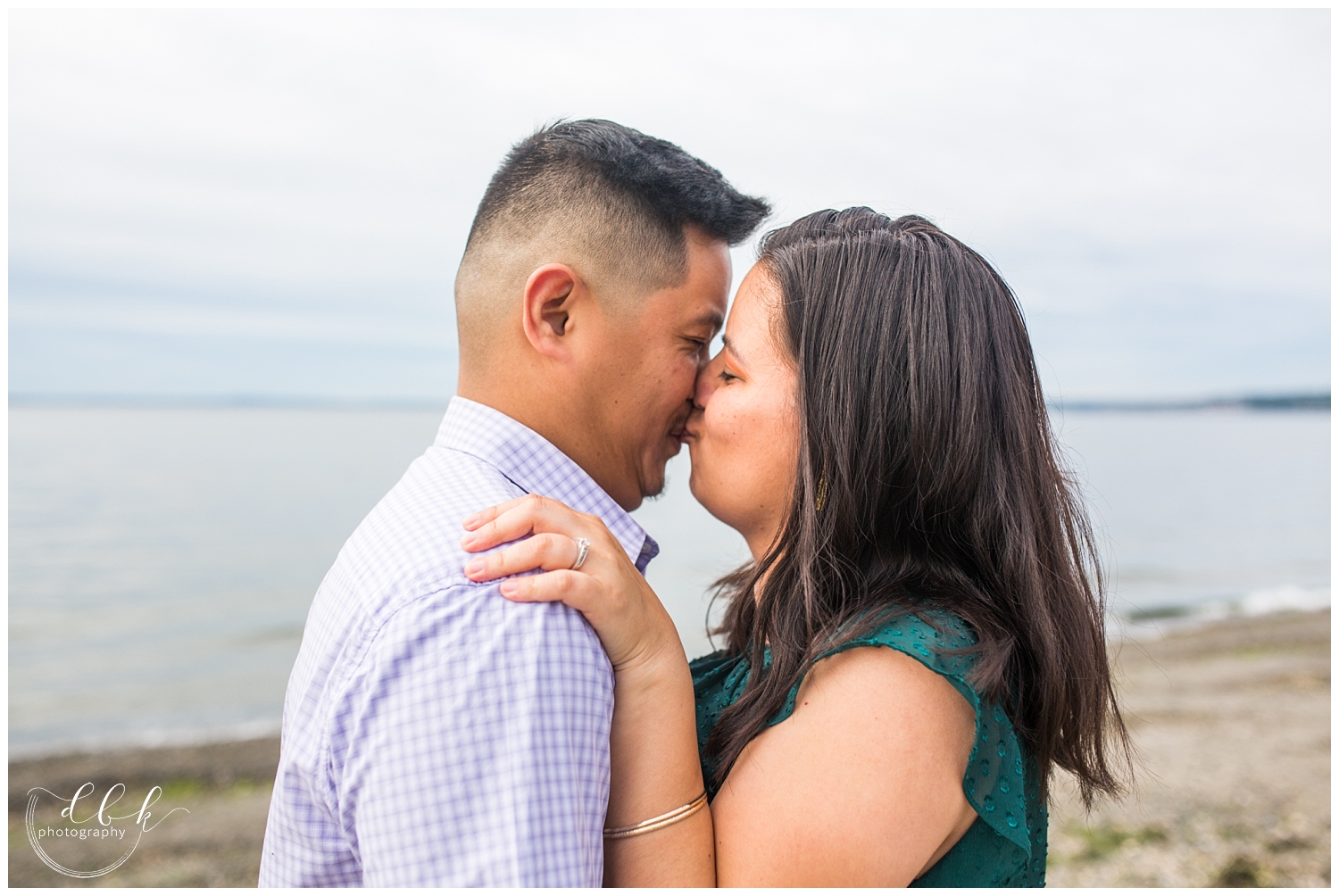 cute close-up of future bride and groom during engagement pictures at Alki Beach in Seattle