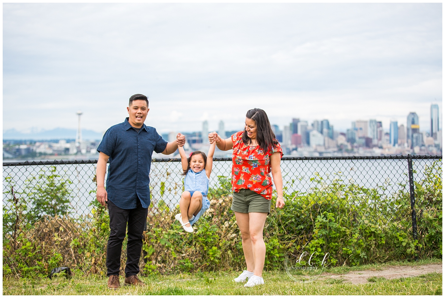Mom and Dad lifting daughter between them during spring engagement session at Hamilton Viewpoint Park