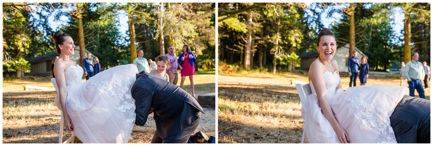 groom searching for the garter at wedding reception in Washington Park picnic area in Anacortes