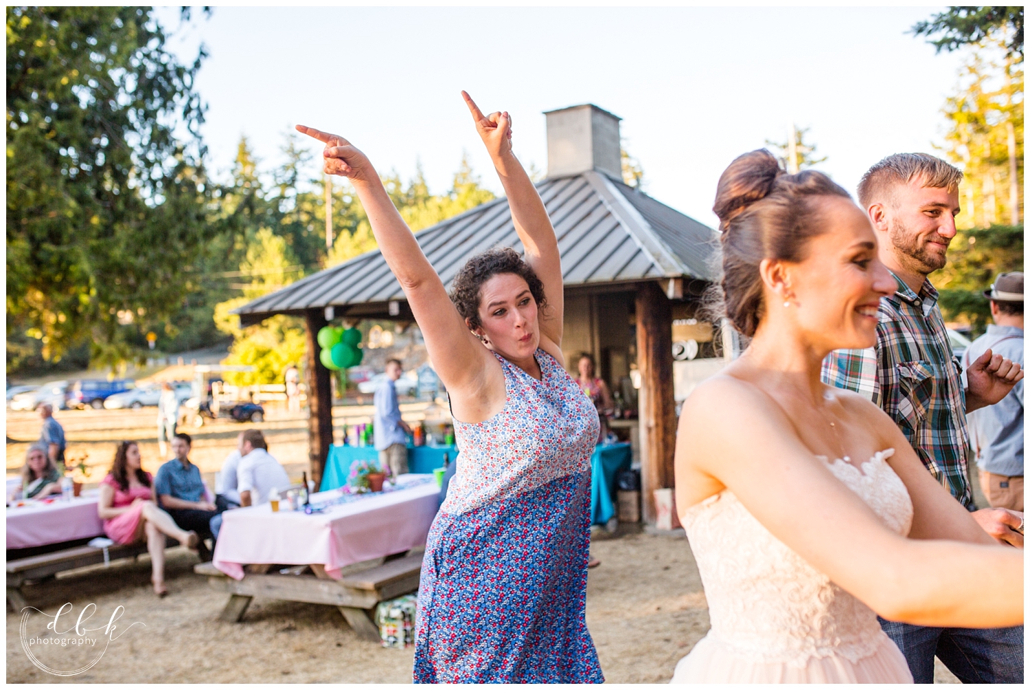 guests dancing with the bride at Anacortes wedding reception at Washington Park picnic area in Anacortes, Washington