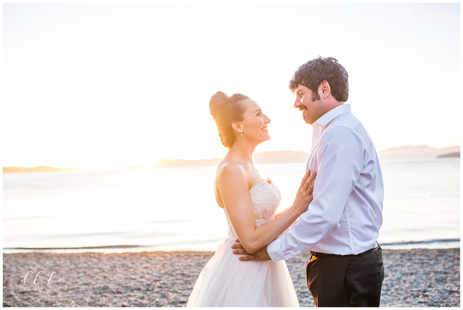 bride and groom stare at each other for sunset portraits after Washington Park wedding in Anacortes
