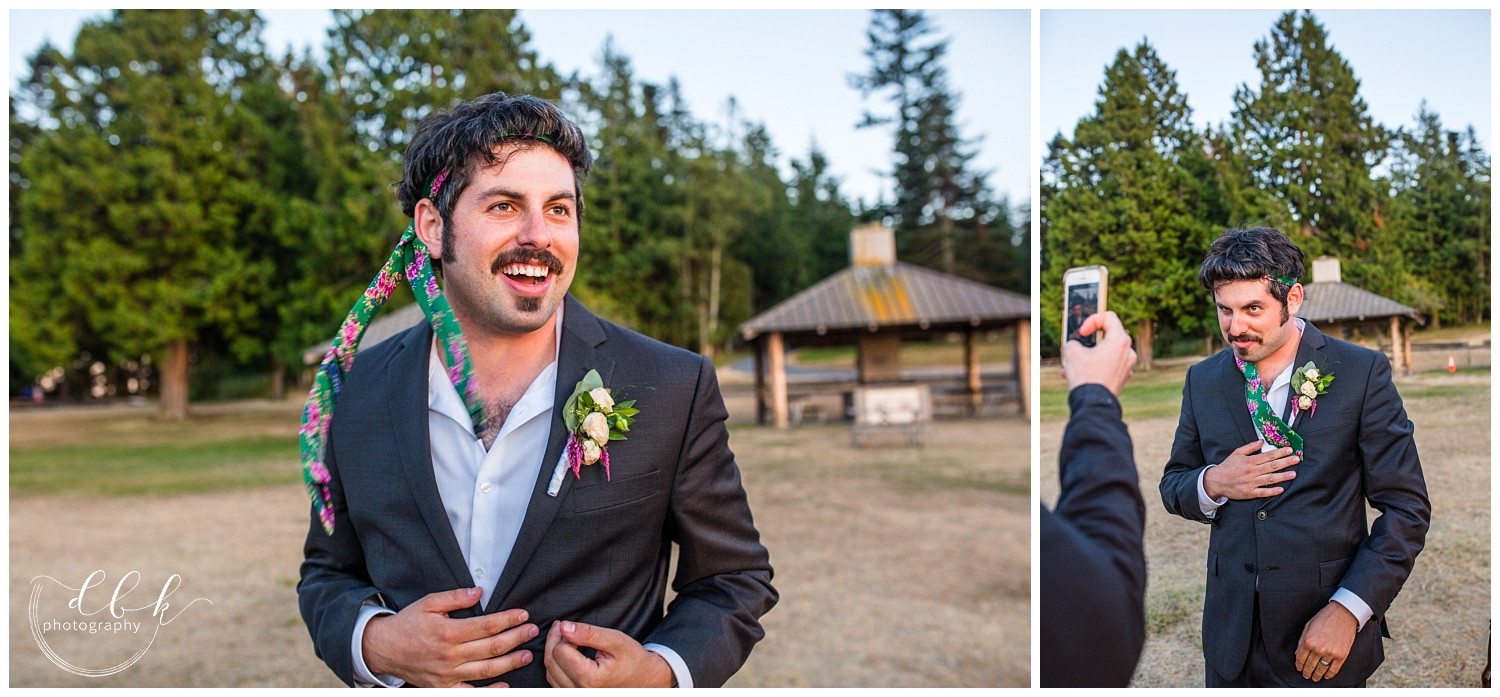 groom being silly with his floral tie wrapped around his head