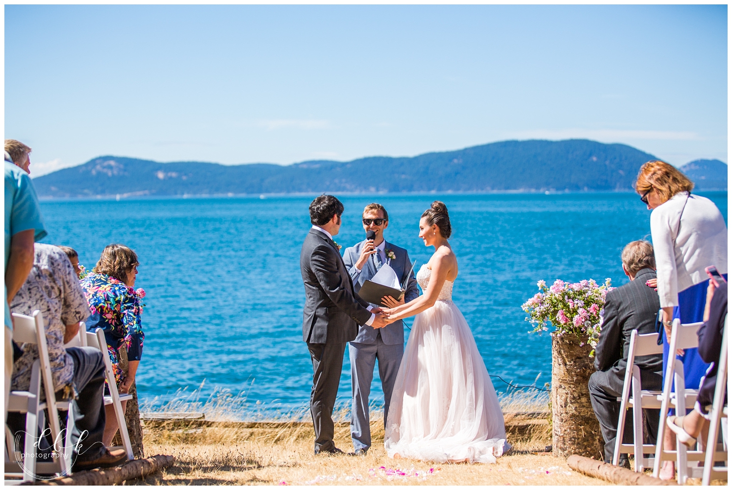 bride and groom face each other at their Anacortes wedding ceremony at Green Point in Washington Park