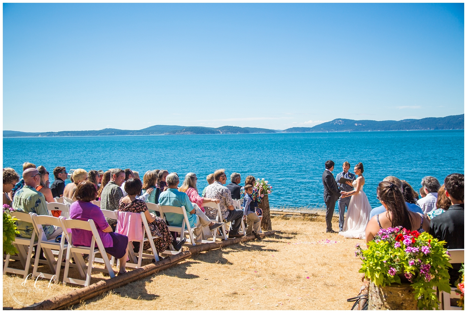 summer wedding ceremony overlooking the water at Green Point in Washington Park, Anacortes