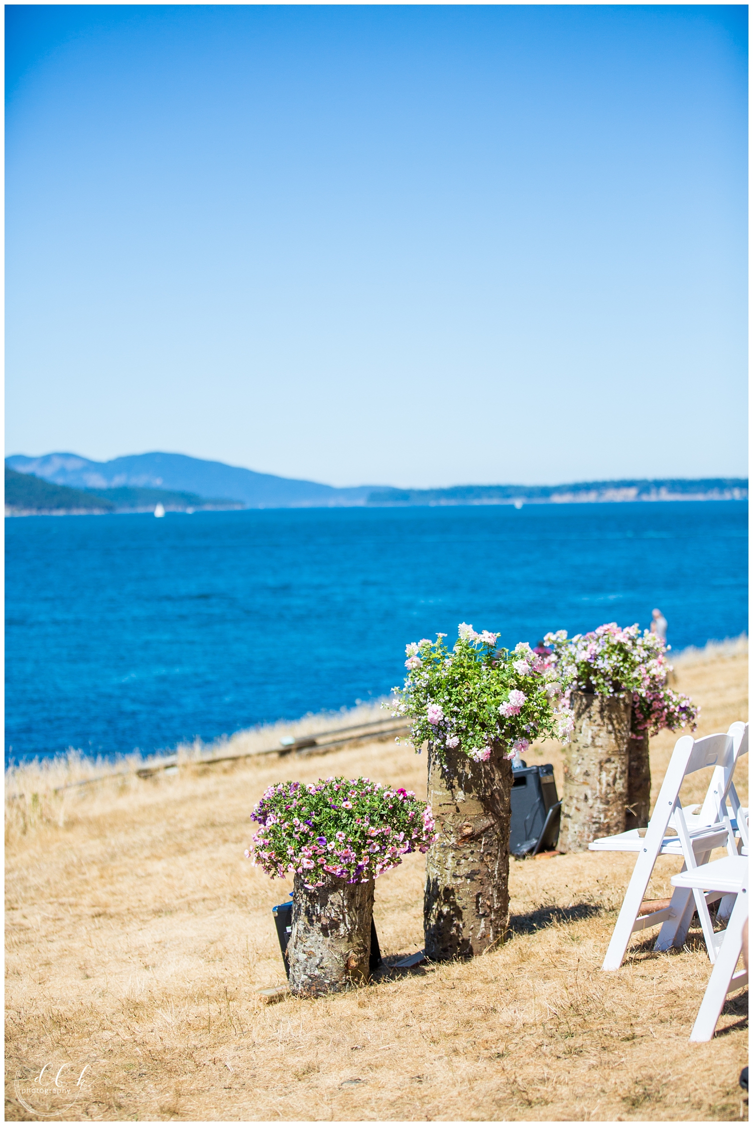 wildflower bouquets decorate wedding ceremony at Green Point in Washington Park, Anacortes