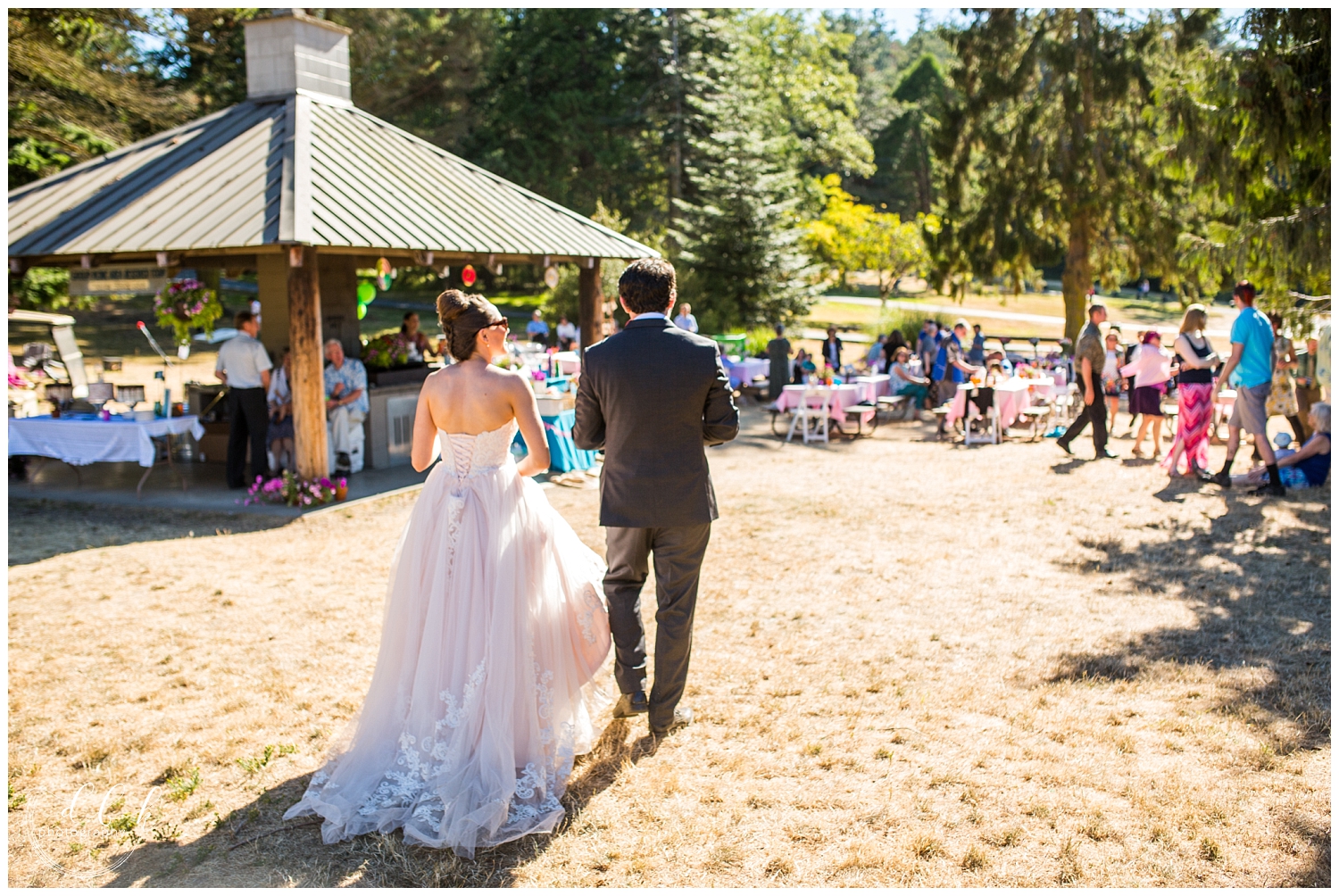 bride and groom entering their reception at Washington Park picnic area in Anacortes, Washington