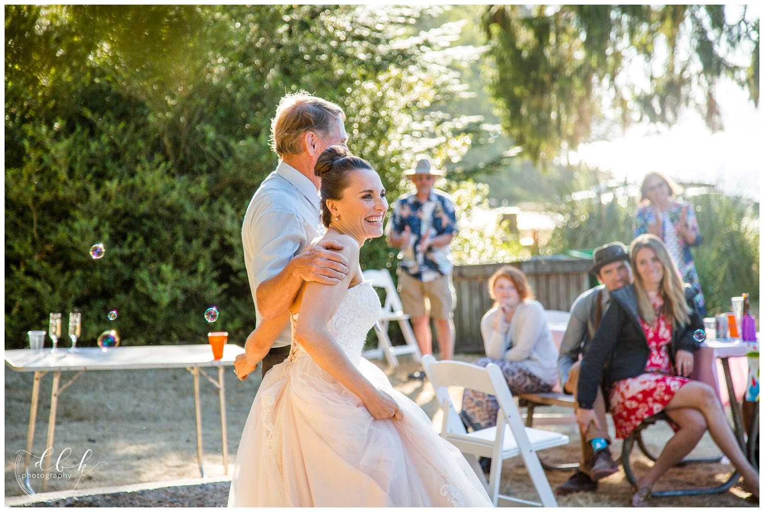 a happy bride at her Anacortes wedding reception at Washington Park picnic area