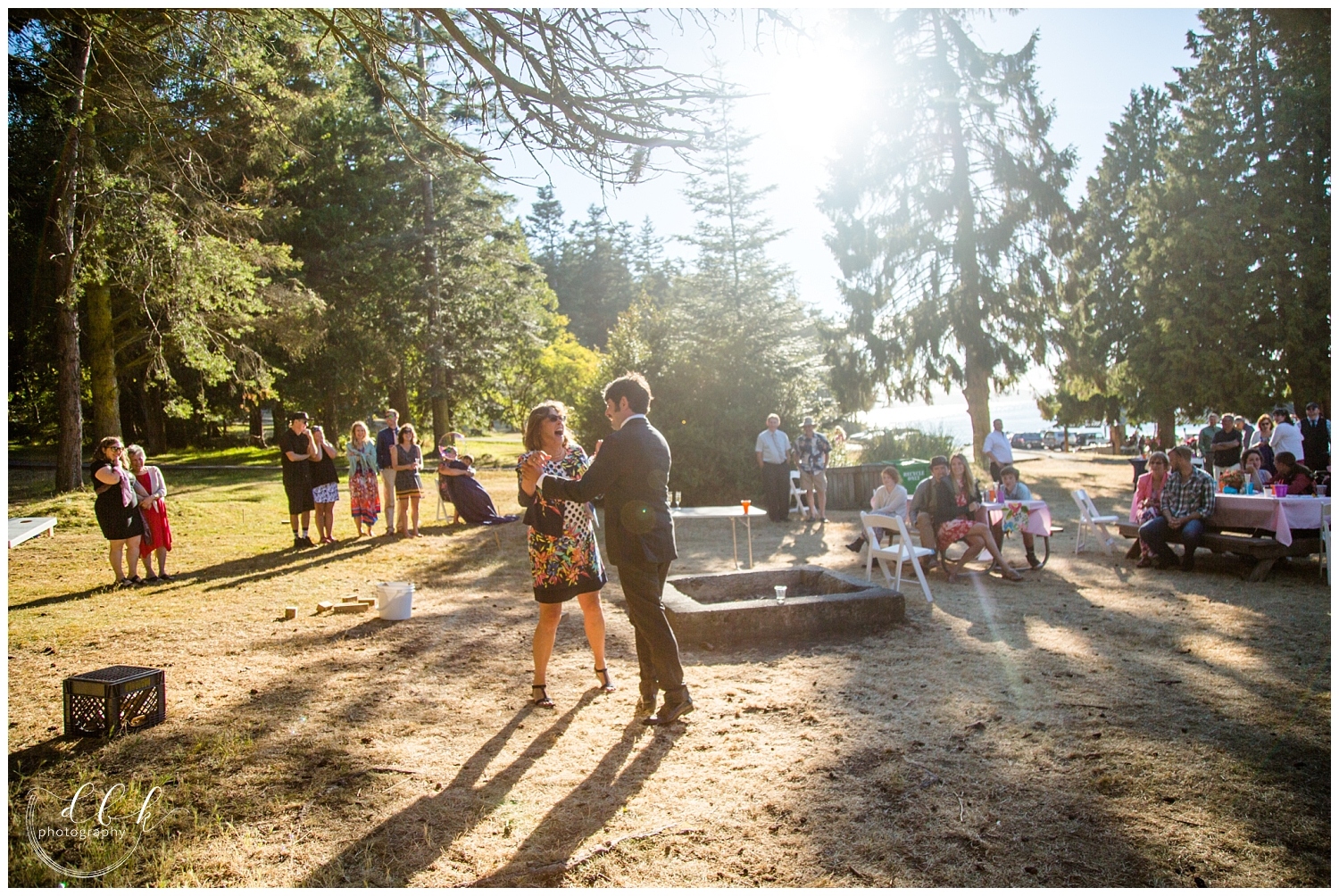 groom dances with his mother at Washington Park picnic area wedding reception