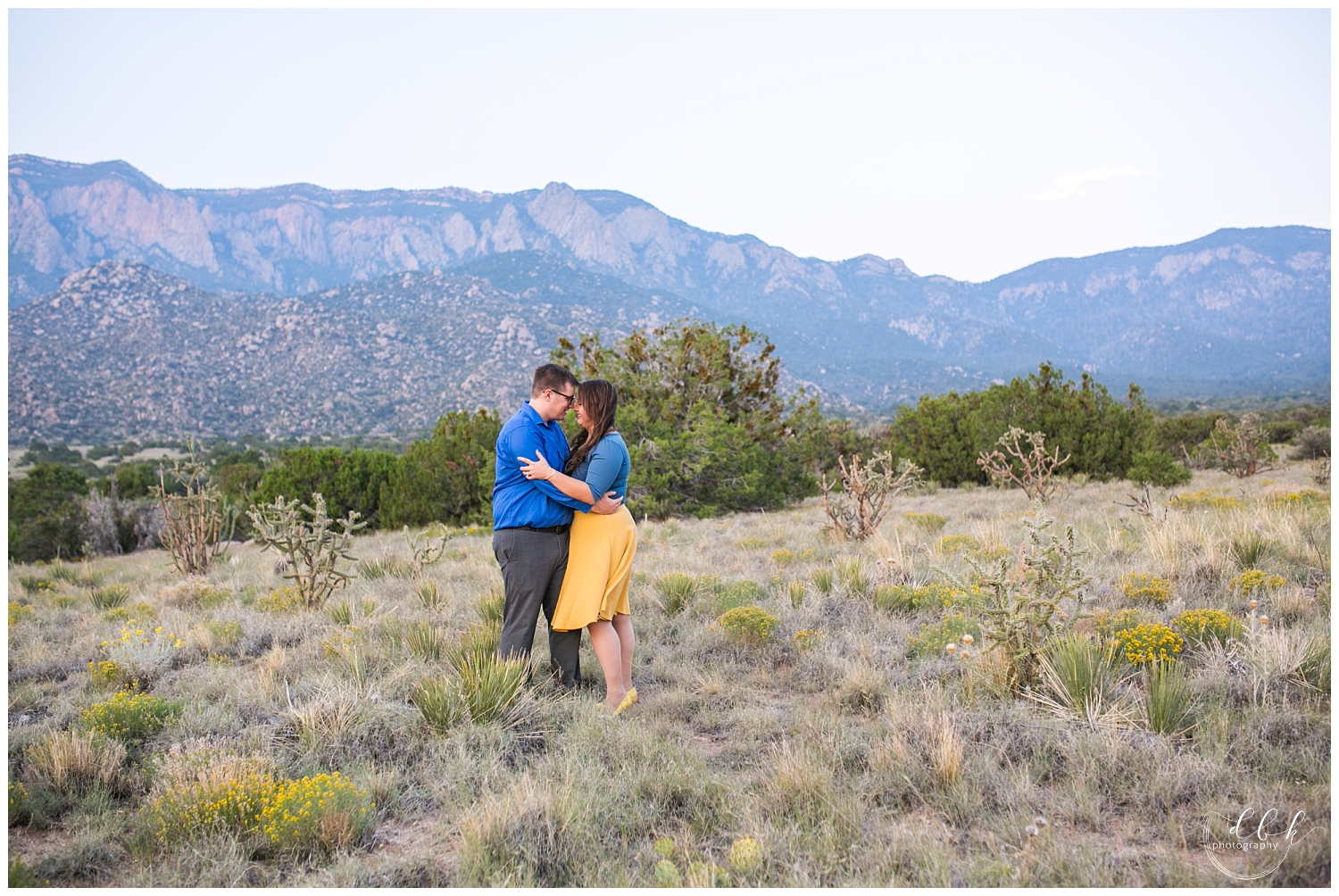 bride and groom kissing for engagement pictures at Elena Gallegos park in Albuquerque New Mexico