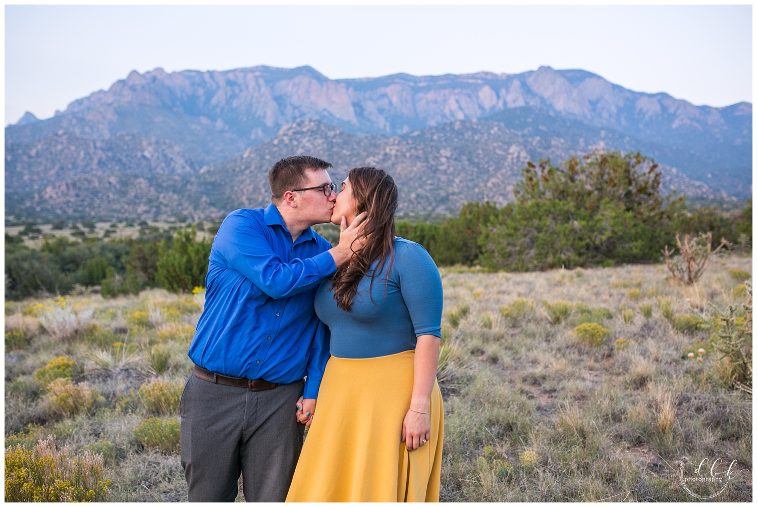 blue and yellow themed engagement pictures at Elena Gallegos Hiking Trail in Albuquerque, New Mexico