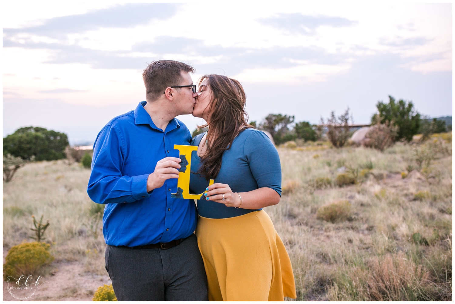 future husband and wife kissing for engagement pictures in Elena Gallegos Open Space, Albuquerque, New Mexico