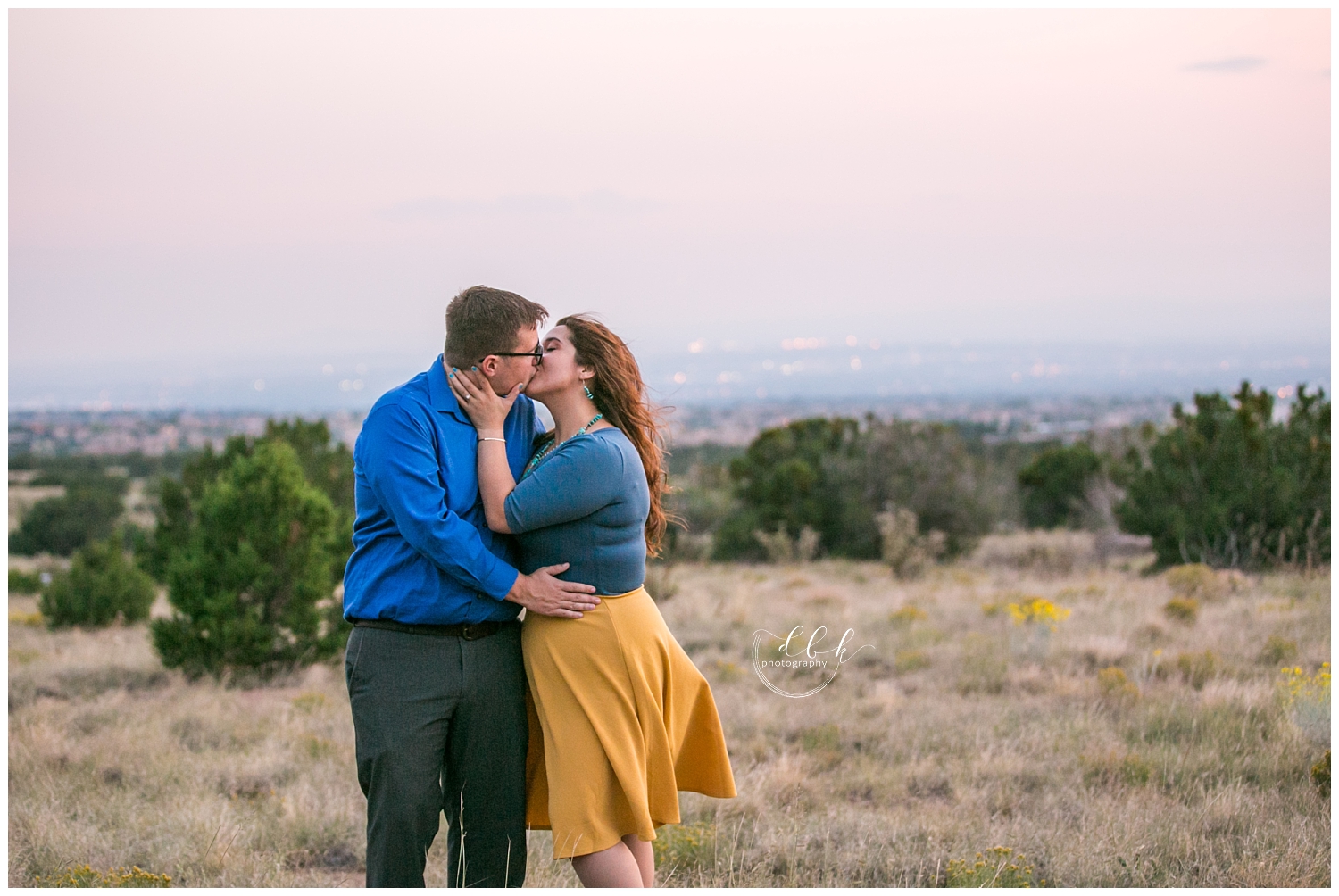 New Mexico engagement pictures in the desert of Sandia Mountain foothills overlooking Albuquerque
