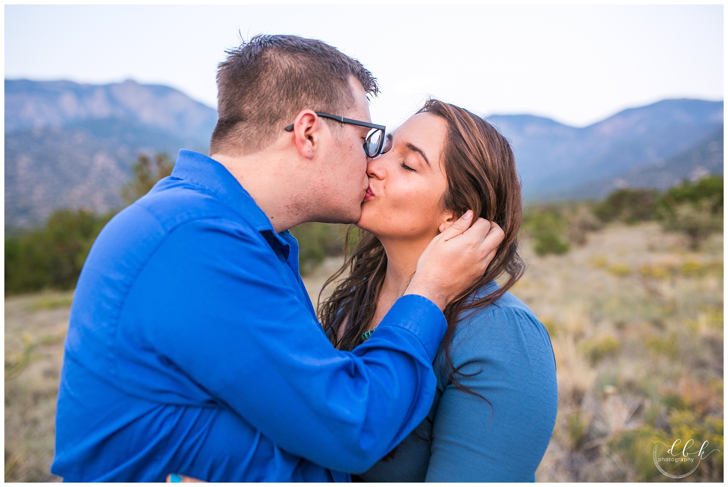 groom kissing his future bride in the high desert of New Mexico