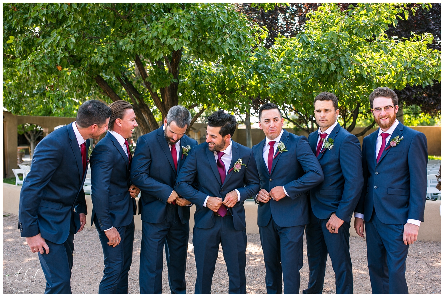 groomsmen buttoning their coats at Casa Rondena Winery wedding