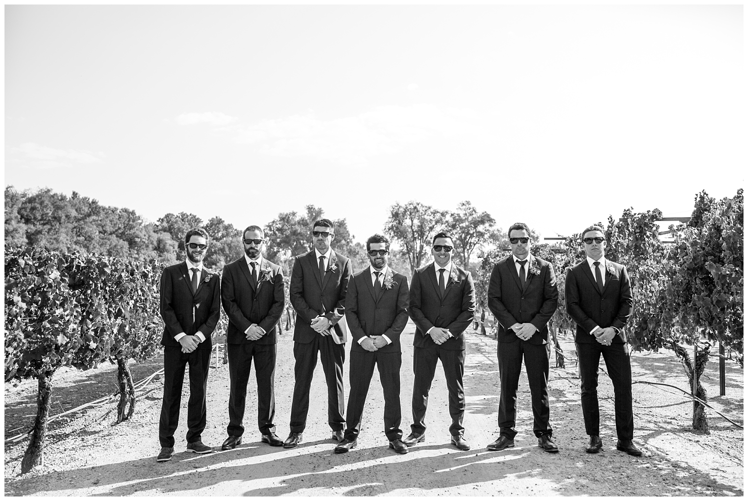 black and white portrait of groomsmen in sunglasses at Casa Rondena Winery