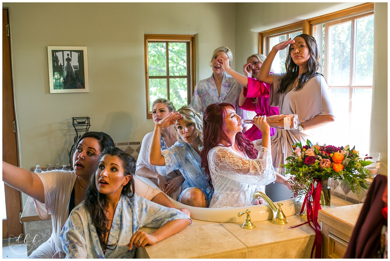 bridesmaids sitting in the bathtub in the bridal suite at Casa Rondena Winery in Albuquerque, New Mexico