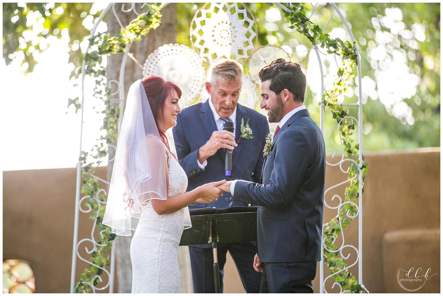 bride and groom exchanging rings at Casa Rondena Winery wedding in Albuquerque, New Mexico