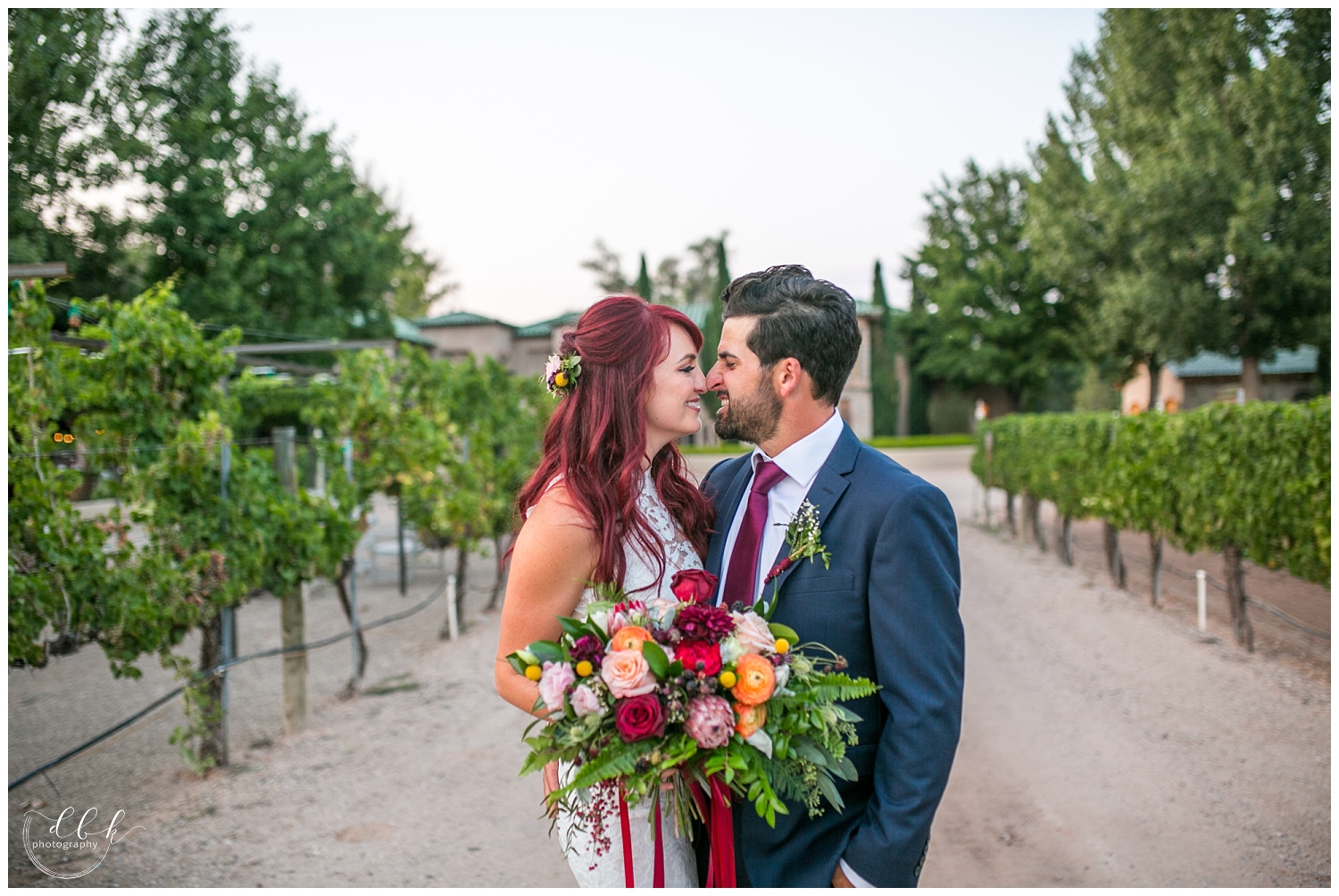 bride and groom touching noses in driveway at Casa Rondena Winery