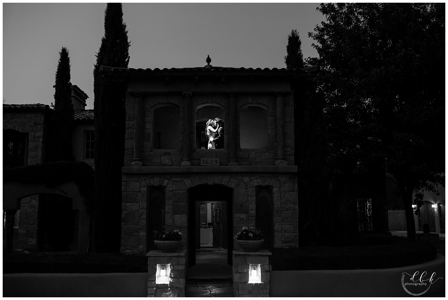wedding couple dancing in a window in a tower at Casa Rondena Winery at night