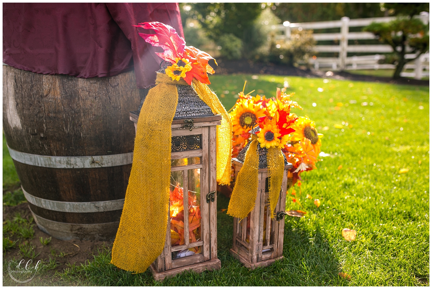 fall Filigree Farm wedding ceremony details: lanterns and orange leaves and flowers