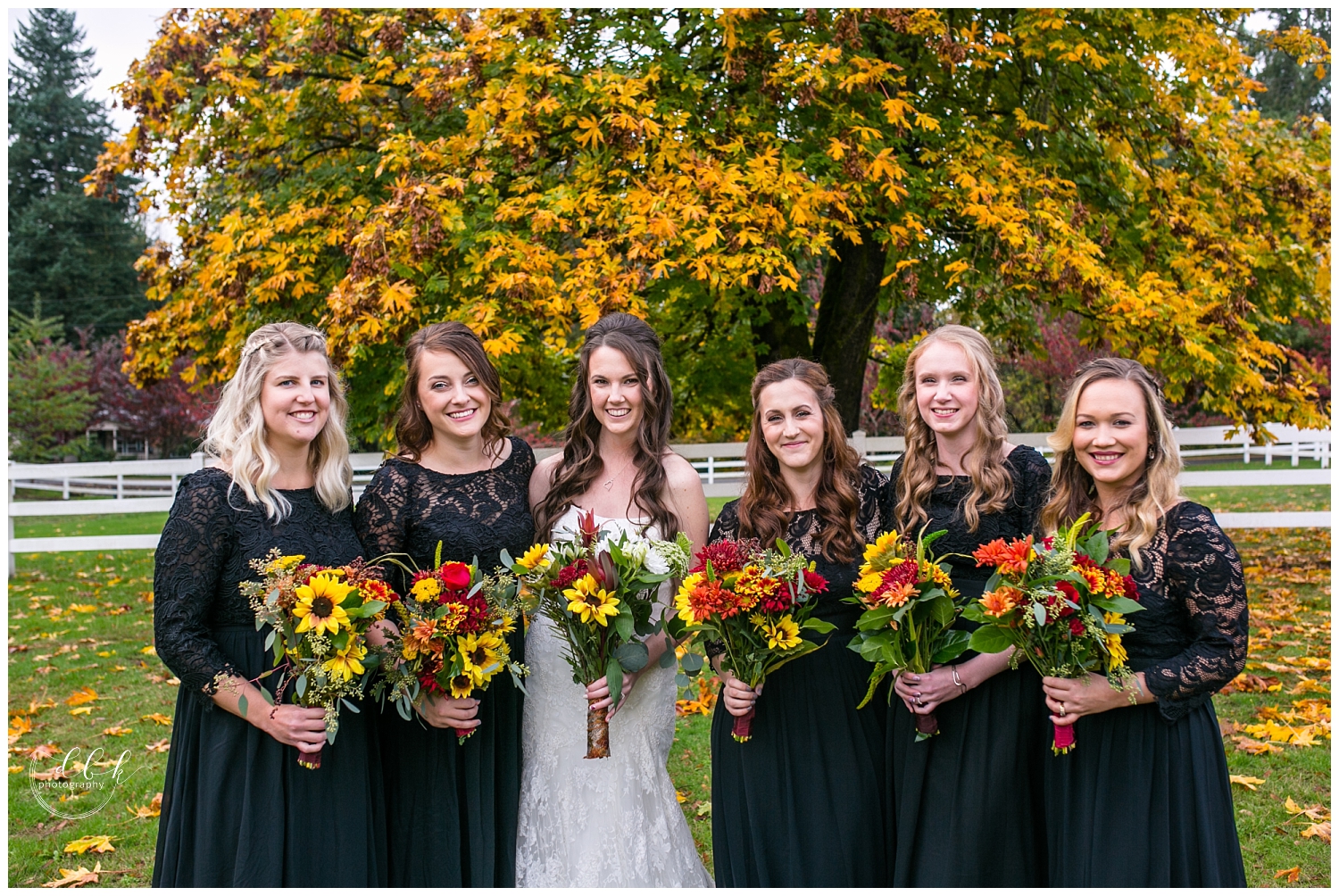 bridesmaids portraits under colorful tree at Filigree Farm fall wedding
