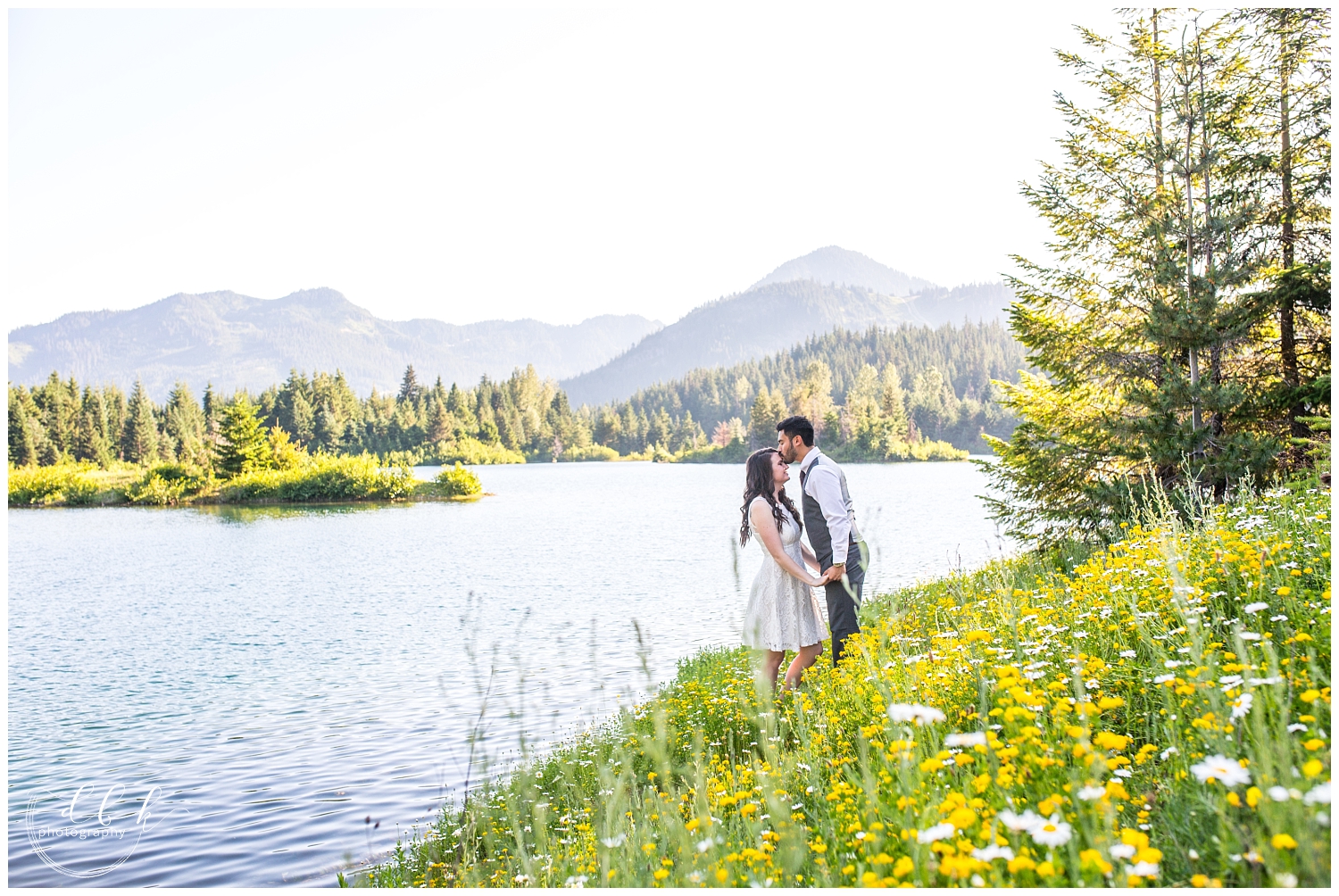 bride and groom kissing in field of wildflowers at Gold Creek Pond