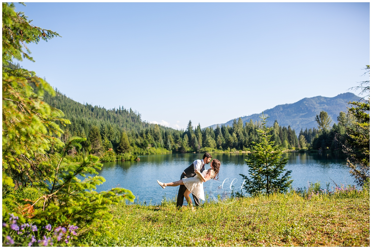 couple dancing in the sunshine on the water at Gold Creek Pond