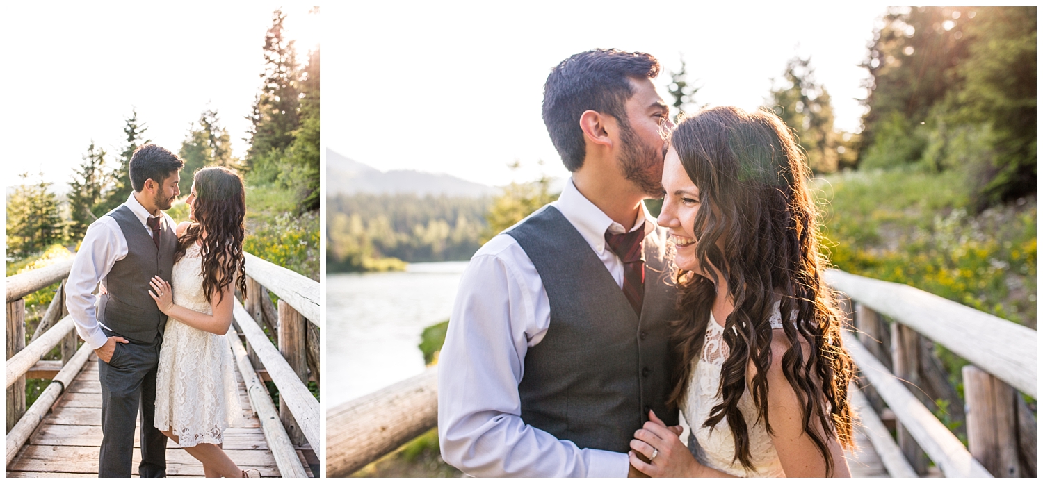 couple on a bridge for summer engagement portraits at Gold Creek Pond