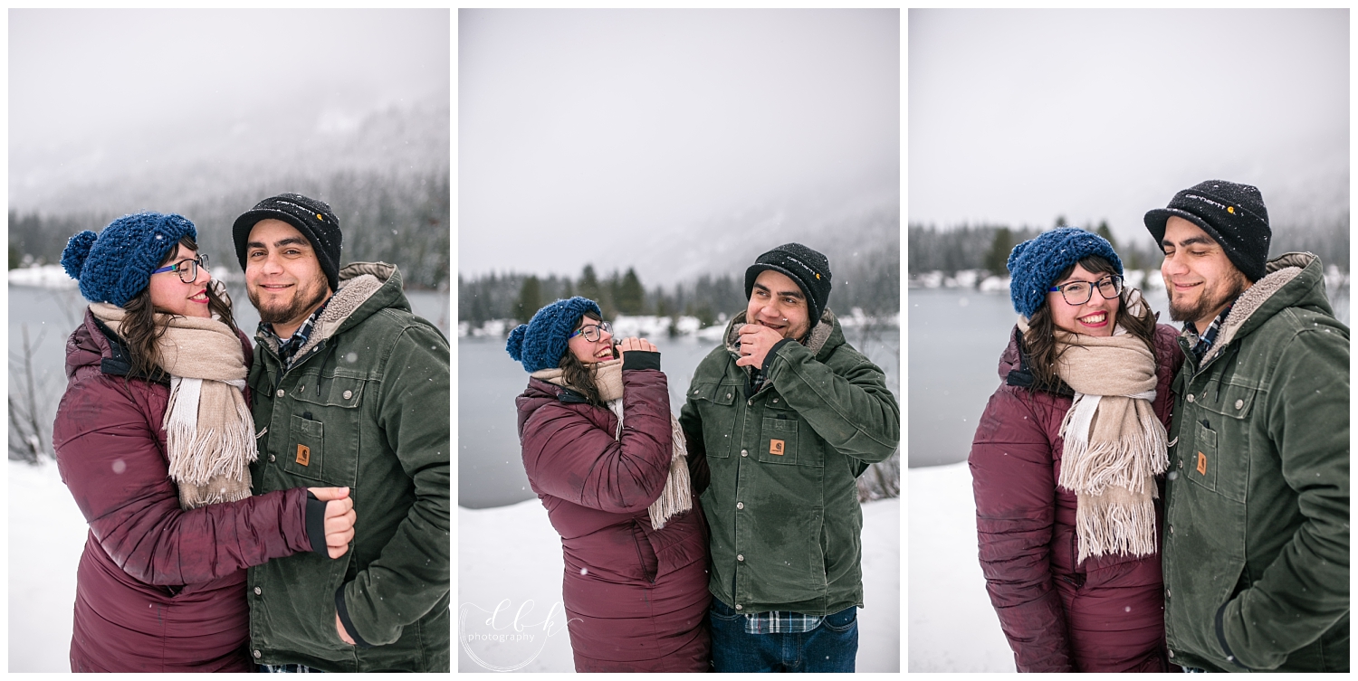 parents bundled in jackets posing for some couples portraits during family pictures at Gold Creek Pond, Washington