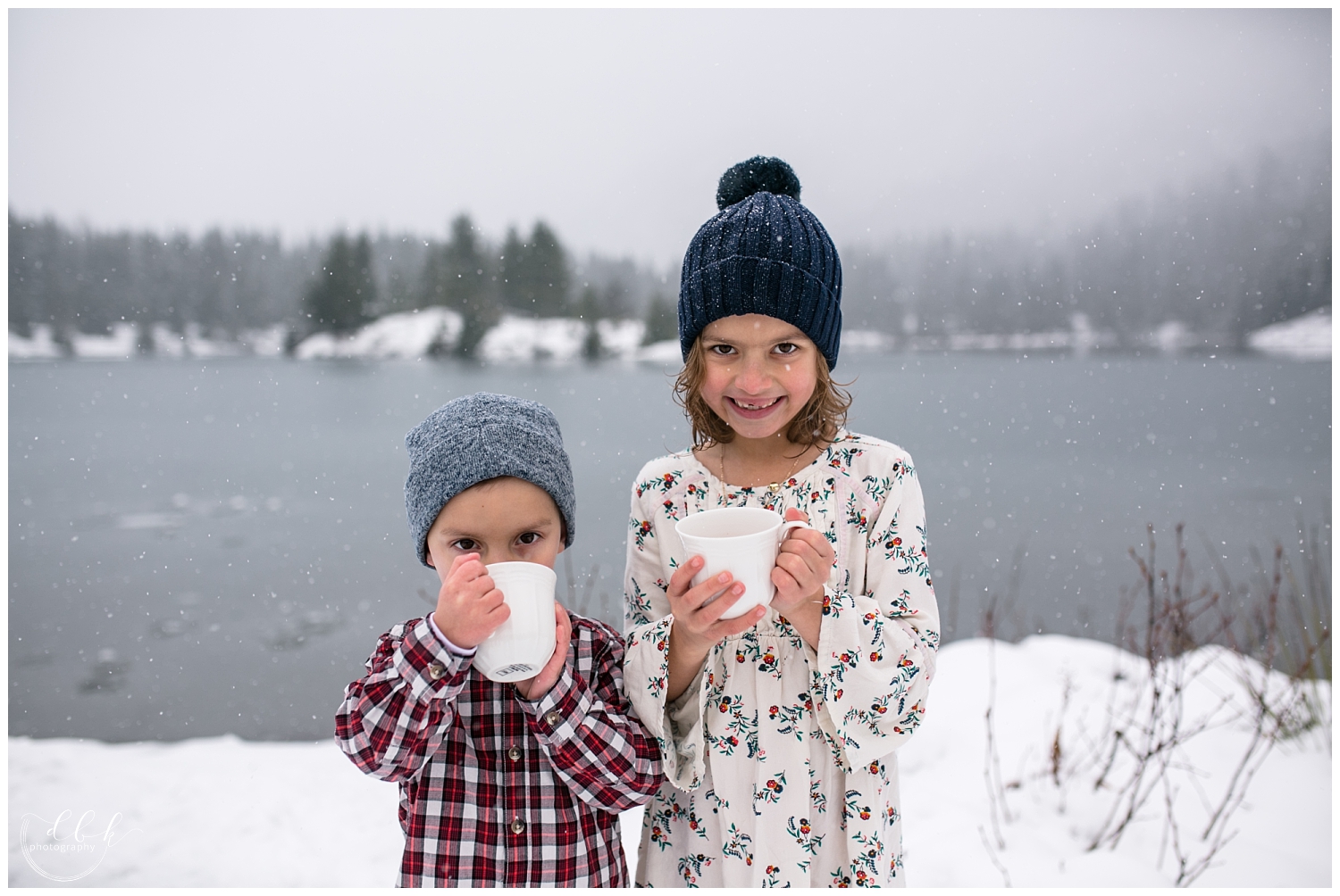 brother and sister sipping hot cocoa during winter family portraits at Gold Creek Pond, Washington