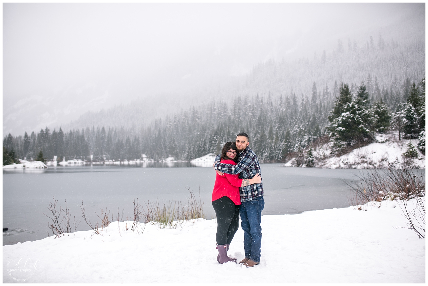 mom and dad hugging for couple's portraits during family session at Gold Creek Pond, Washington