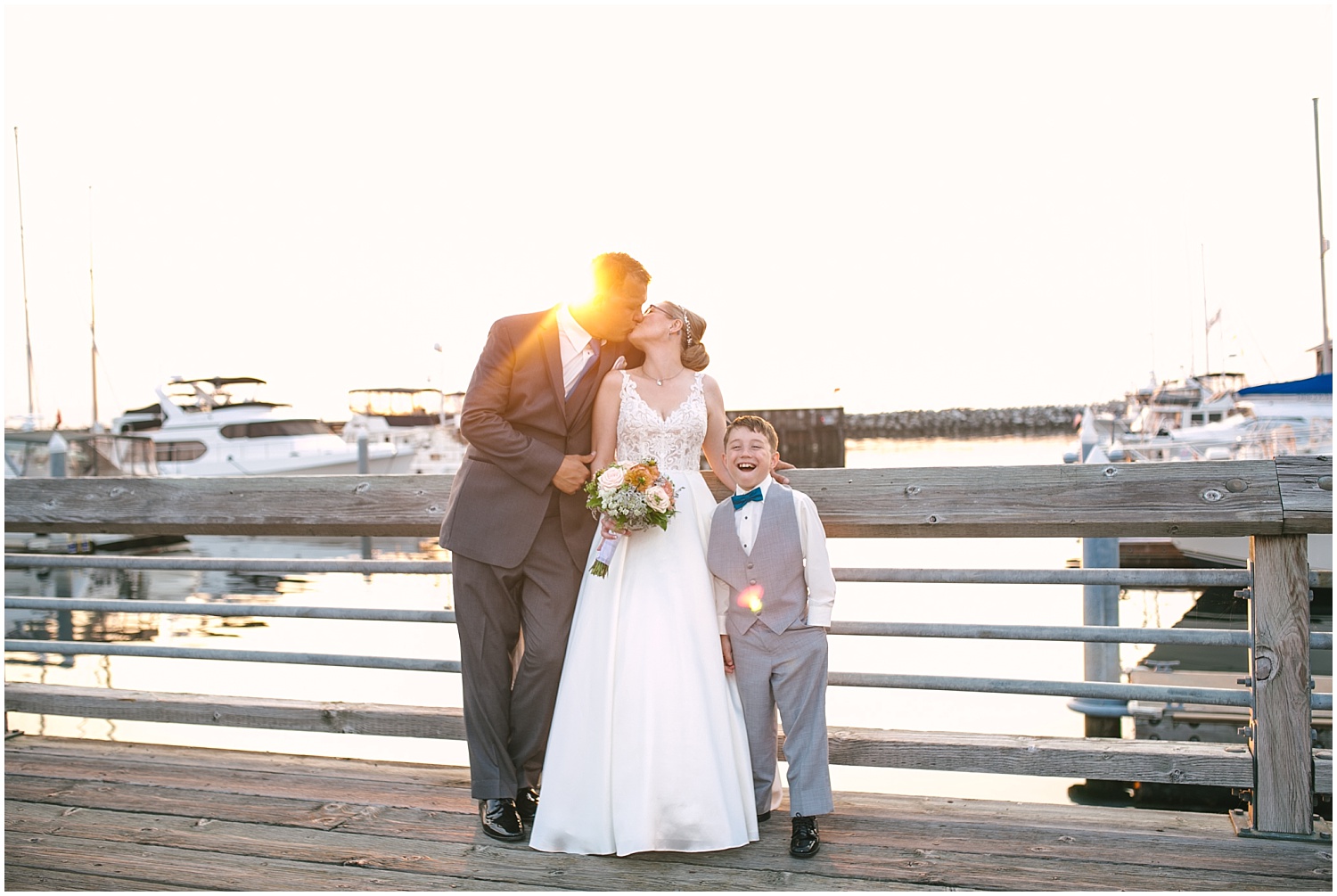 Bride and groom sunset portraits on the dock at Edmonds Yacht Club wedding