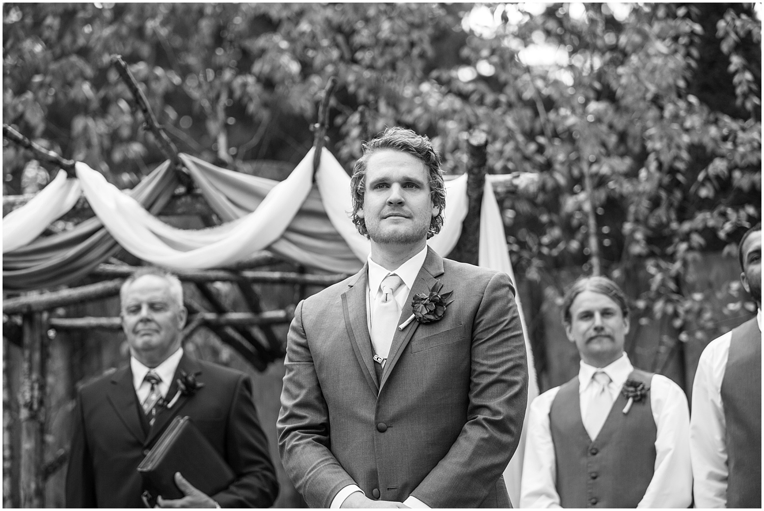 Groom watches bride coming down the aisle at Black Diamond Gardens wedding