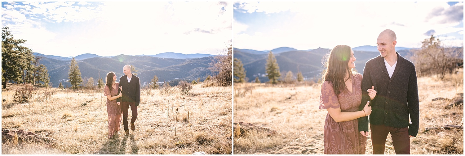 Couple walking in a field in the mountains for Mount Falcon engagement photos