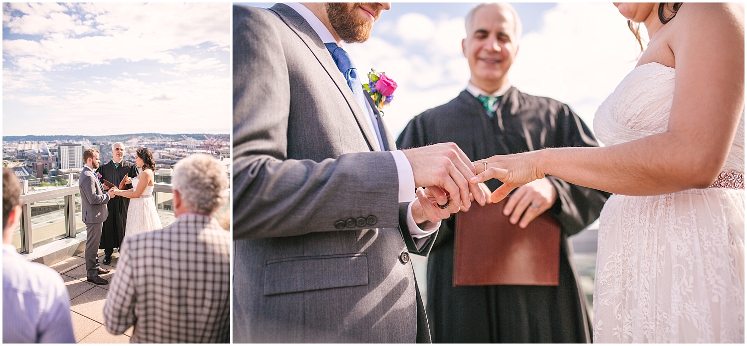 Bride and groom exchanging rings at Seattle Municipal Court wedding ceremony on the rooftop.