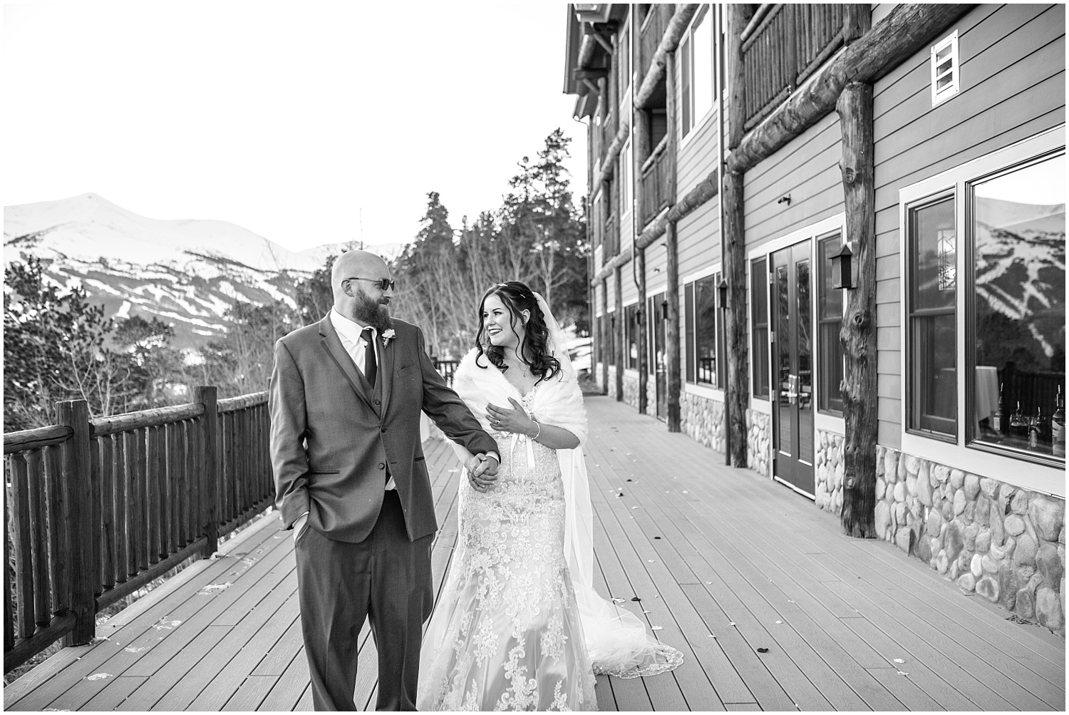 bride and groom portraits on the deck at The Lodge at Breckenridge winter wedding