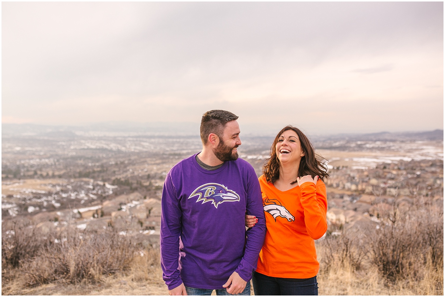 Castle Rock Colorado engagement photos in football jerseys at Ridgeline Open Space.