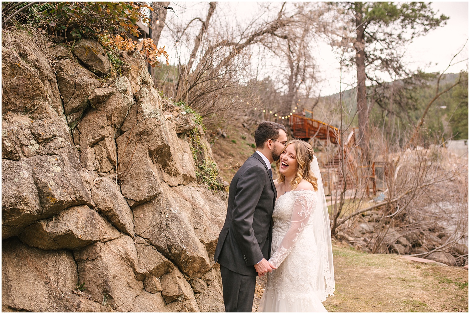 Groom kissing his bride's cheek at Wedgewood Weddings Boulder Creek