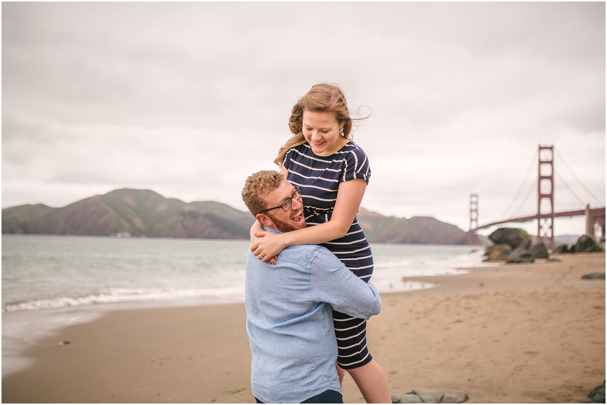 Laughing couple at Marshall Beach San Francisco engagement pictures