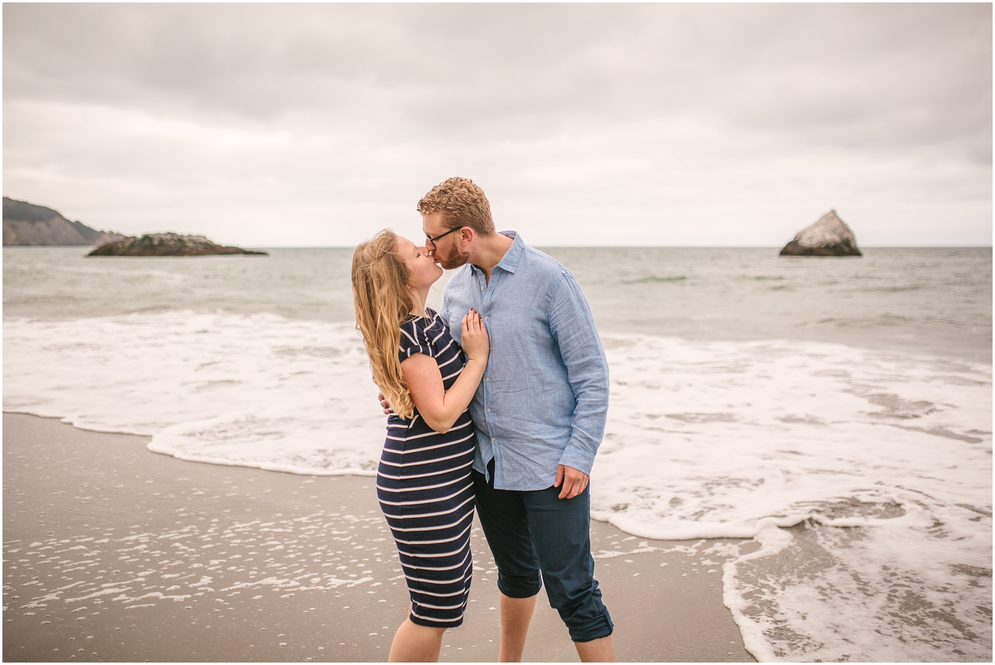 Kissing couple on the beach - Marshall Beach San Francisco engagement pictures