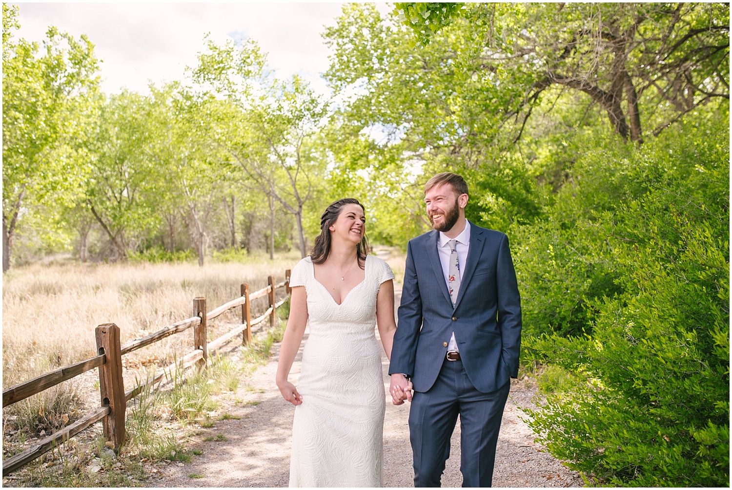 Bride and groom walking through the trees at Hyatt Regency Tamaya wedding in New Mexico