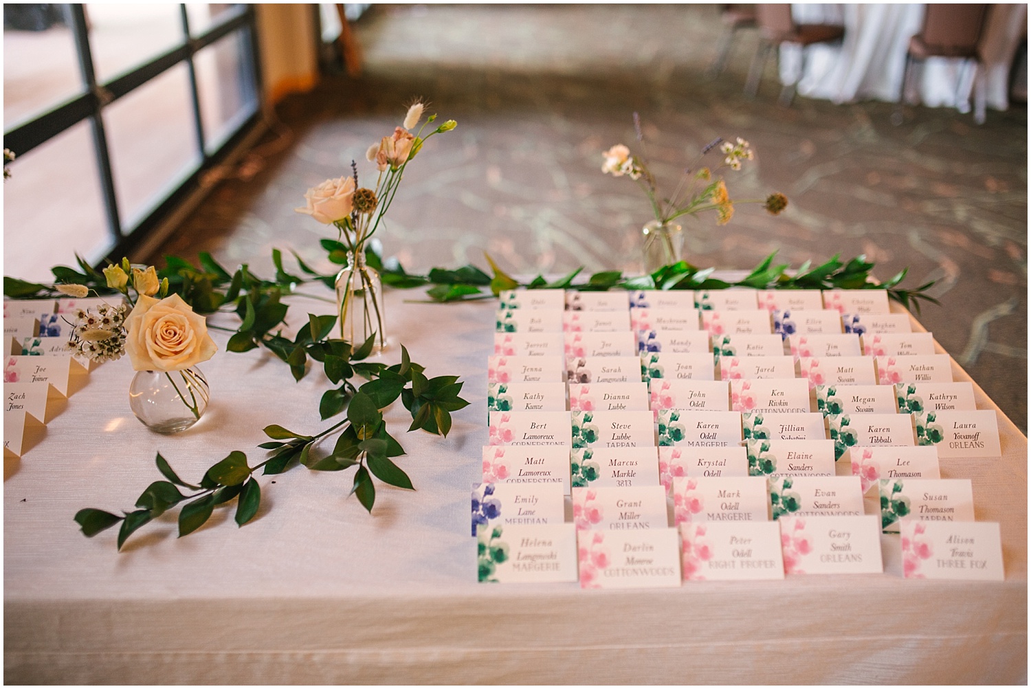 Floral guest place cards for Hyatt Regency Tamaya wedding reception details