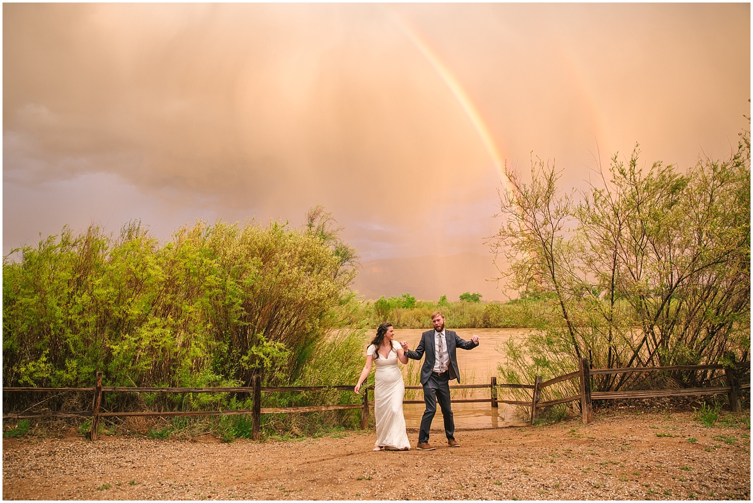 Double rainbow over dancing bride and groom at Hyatt Regency Tamaya wedding in New Mexico