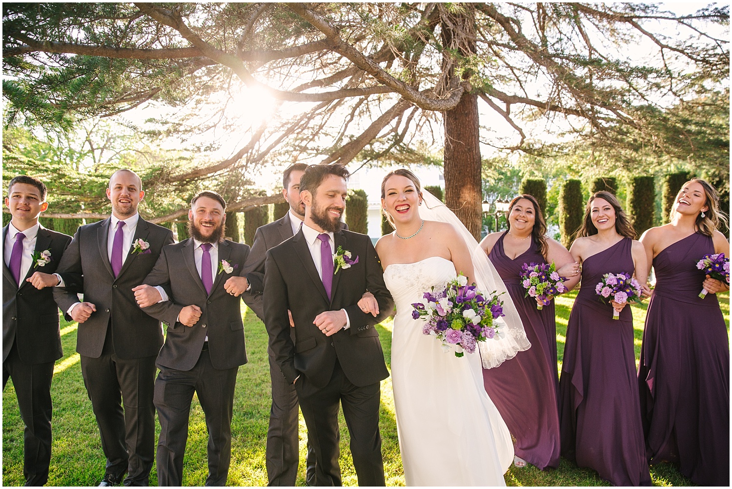 Wedding party dressed in black and purple at Jefferson Street Mansion wedding