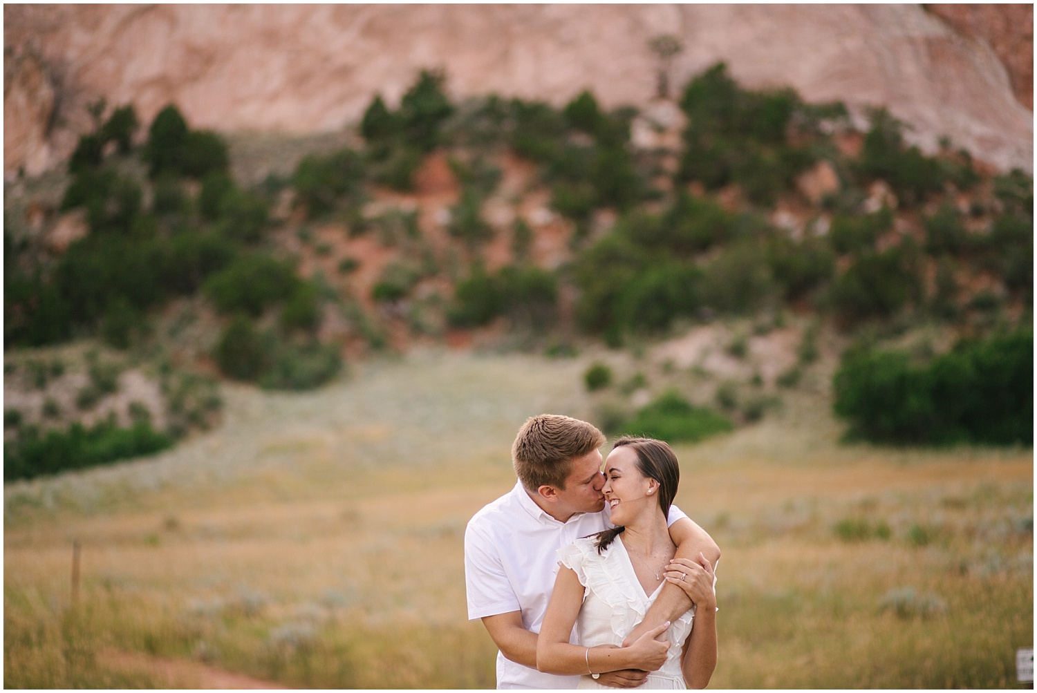 Couple in embrace at Garden of the Gods engagement photos