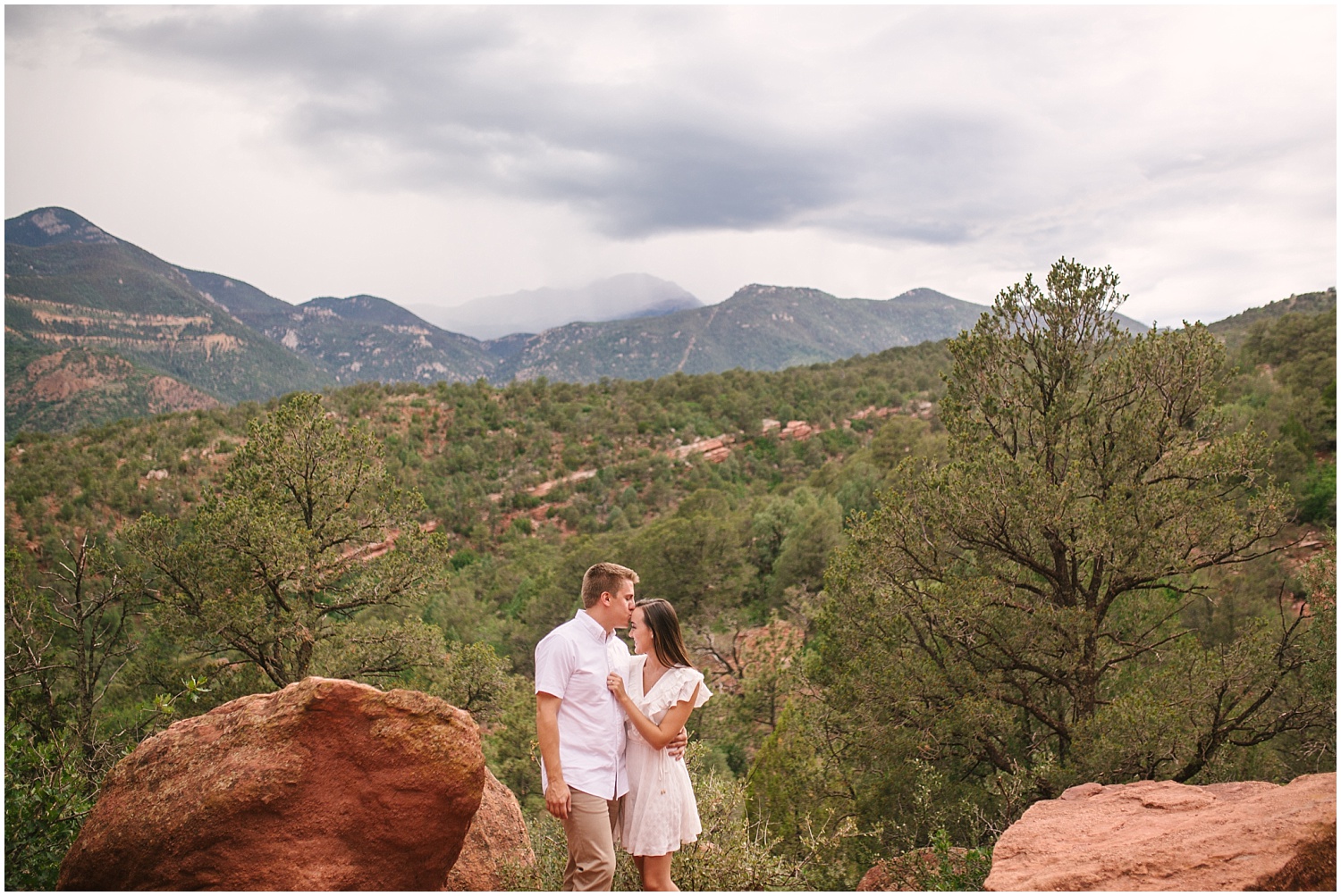 Engaged couple kissing at Garden of the Gods